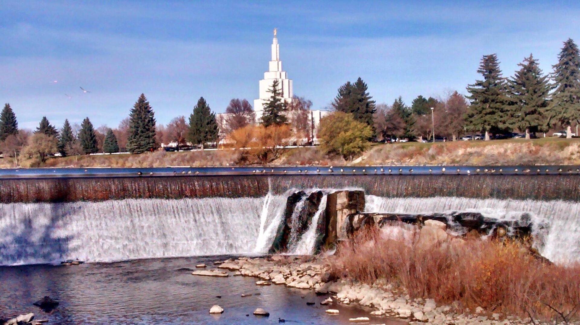 The Snake River and waterfall along the River Walk greenbelt in Idaho Falls, Idaho