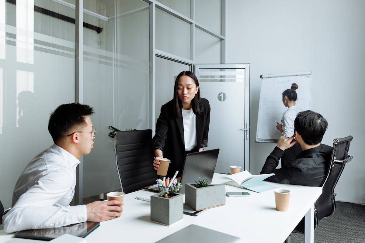 Diverse office team collaborating in a meeting about payroll